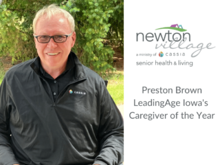 Preston Brown in black shirt with Cassia logo, smiling at the camera. Newton Village Assisted Living logo in the upper right.