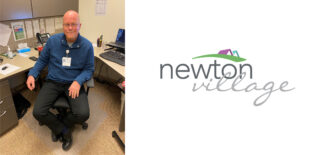 Dan Donohue, the new administrator at Newton Village, sits at his desk in a blue sweater, smiling warmly, reflecting his approachable and collaborative leadership style.