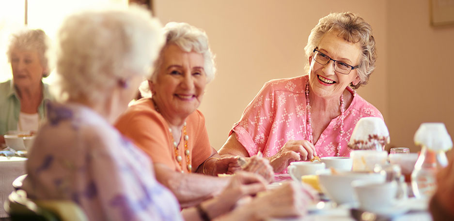 Residents enjoying meals and social time together in a community like Newton Village.