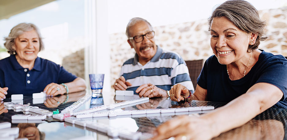 Older adults participating in activities and social engagement like those offered at Newton Village.